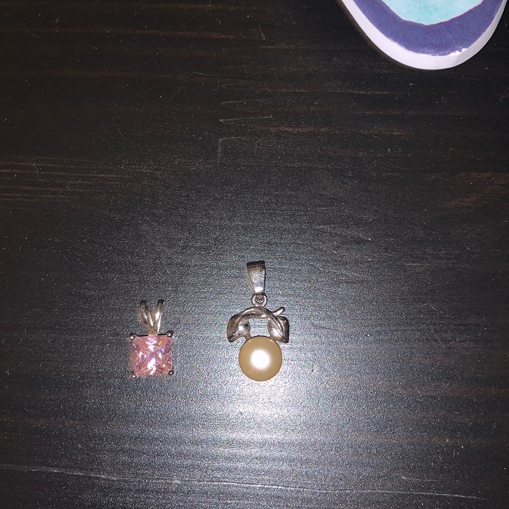 Two necklace pendants
